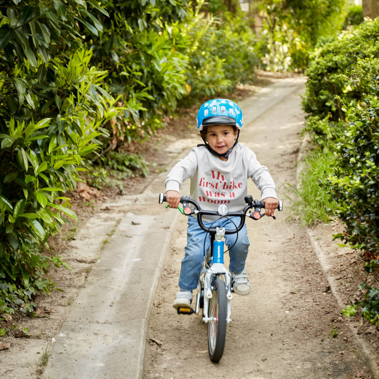 Child riding woom bike
