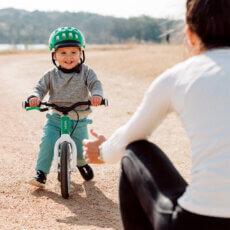 Child riding woom balance bike