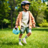 Child riding woom bike with POP basket fitted