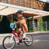 Child riding woom bike with POP basket fitted