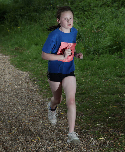 girl running in a junior triathlon