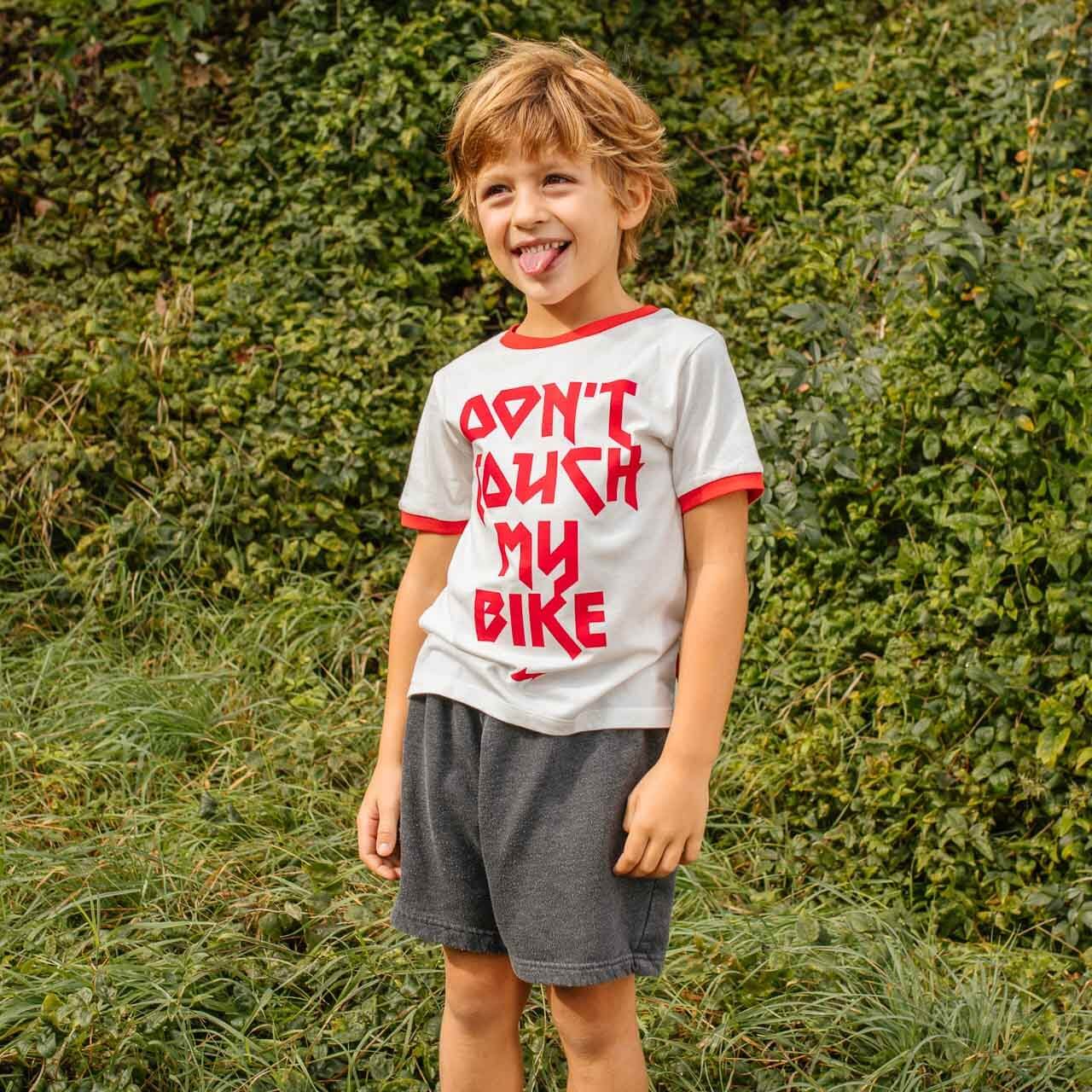 Child wearing woom Don't Touch My Bike T-Shirt