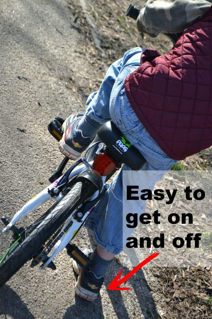 Boy getting on a bike