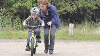 teaching a child to ride a bike